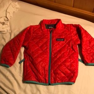 Orange Patagonia quilted primaloft jacket